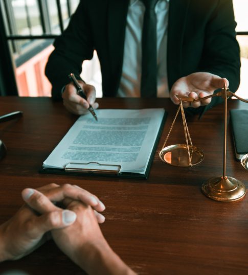 Lawyer is providing information about the client’s trial at the Lawyer is providing information about the client's trial at the lawyer office.